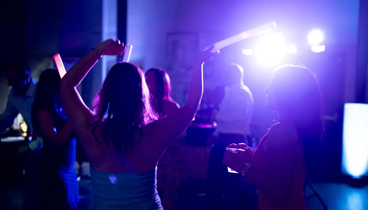 Teens dancing with glow sticks at a Bar Mitzvah celebration in Denver,
captured with professional event photography and dynamic party lighting