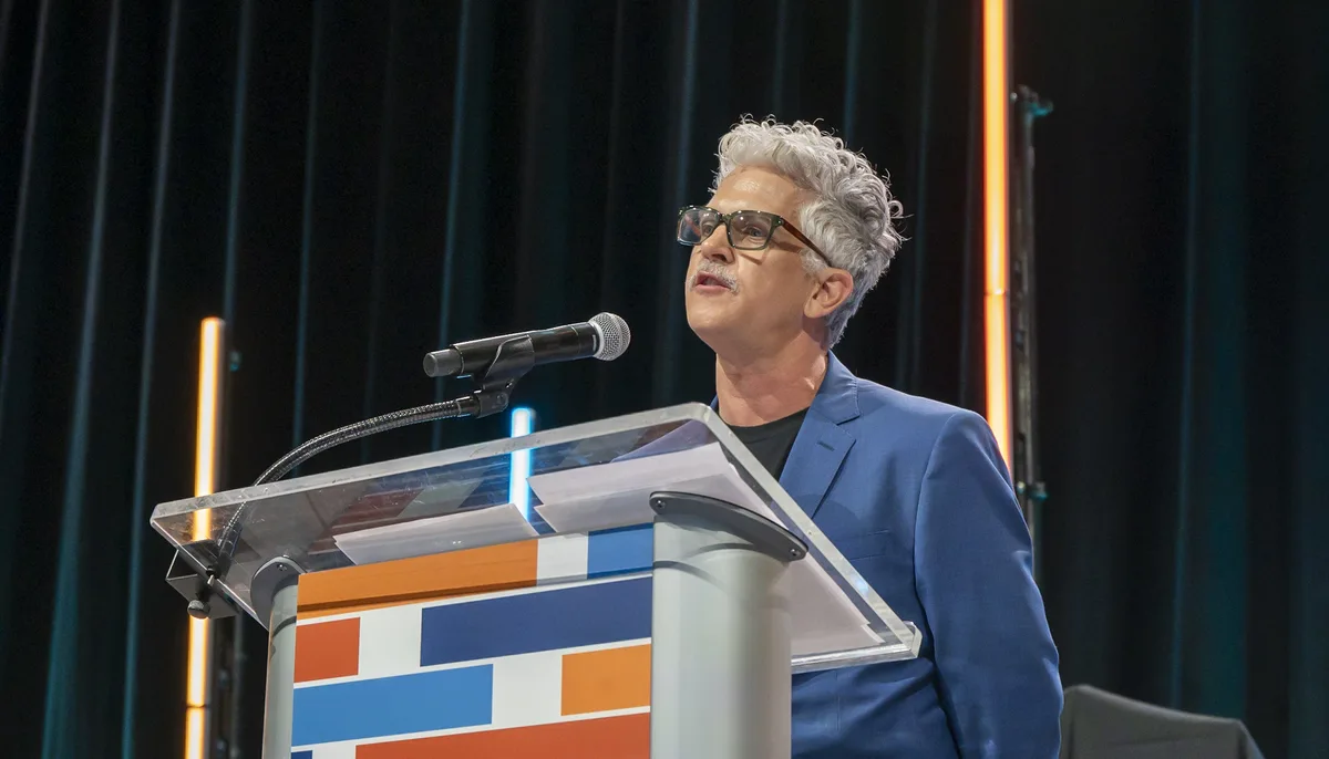 Keynote peaker at a Denver Convention Center awards ceremony, captured
professionally during a live event